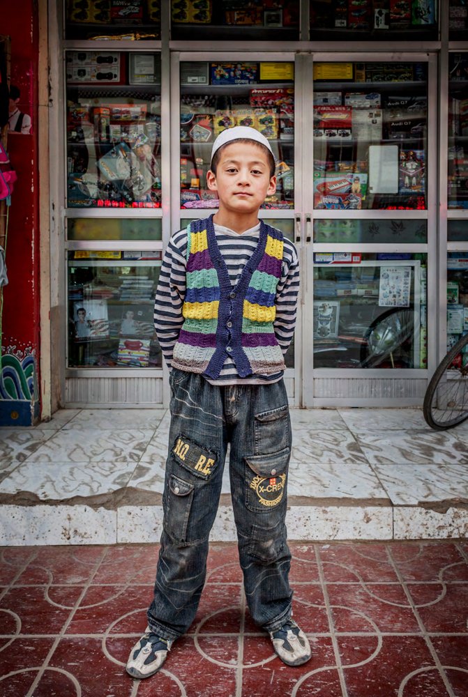 YOUNG SHOP VENDOR. XIAHE COUNTY, GANSU
